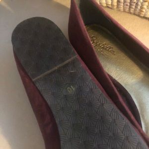 Plum colored ruffled flats